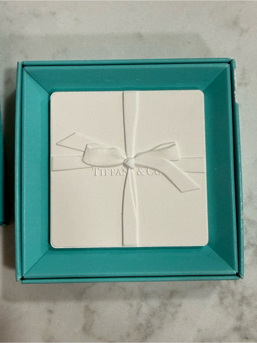 Tiffany & Co. signature blue decorative box with white bow plaque